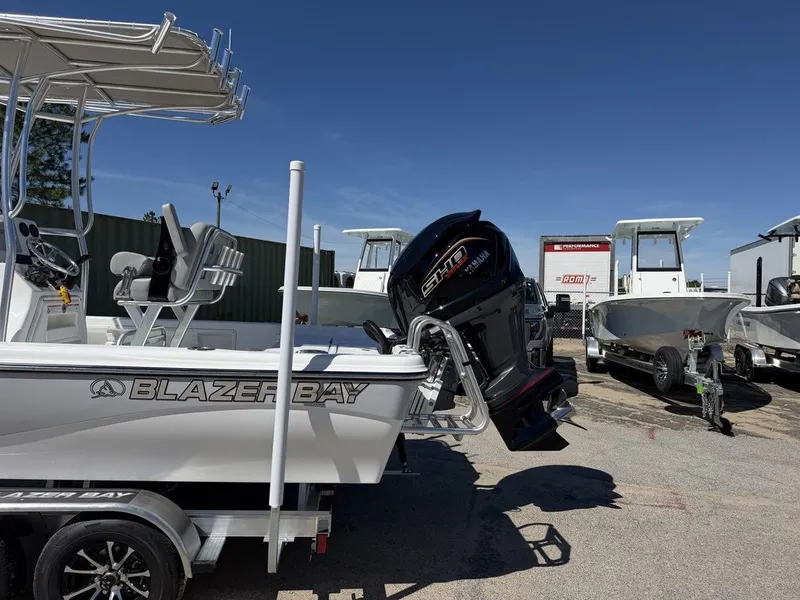 Slide: The Image of 2026 Blazer PureBay 2200 boat with Yamaha engine outdoors. - 8