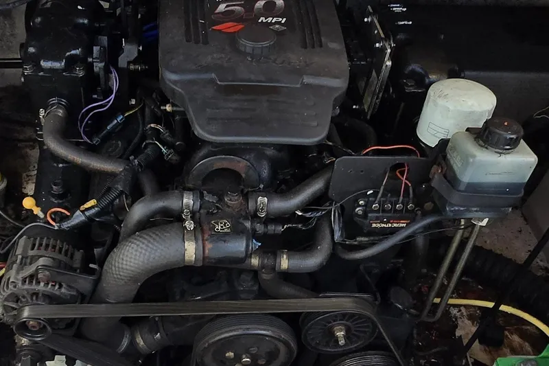 Slide: The Image of Engine of a 2003 Chaparral Sunesta 233 boat, featuring a 5.0 MPI motor. - 4