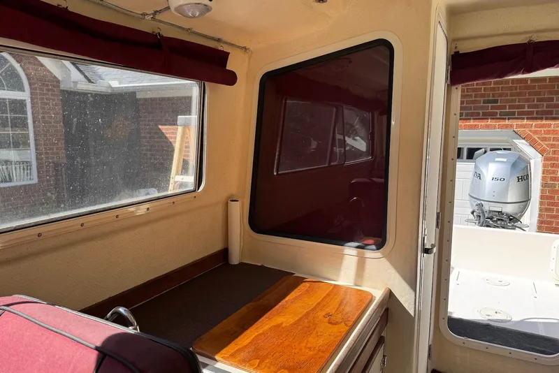 Slide: The Image of Interior of 2007 C-Dory 25 Pilothouse boat with Honda 150 outboard motor. - 18