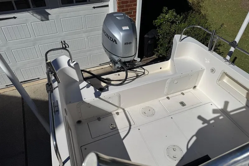 Slide: The Image of 2007 C-Dory 25 Pilothouse boat with Honda 150 outboard motor in driveway. - 7