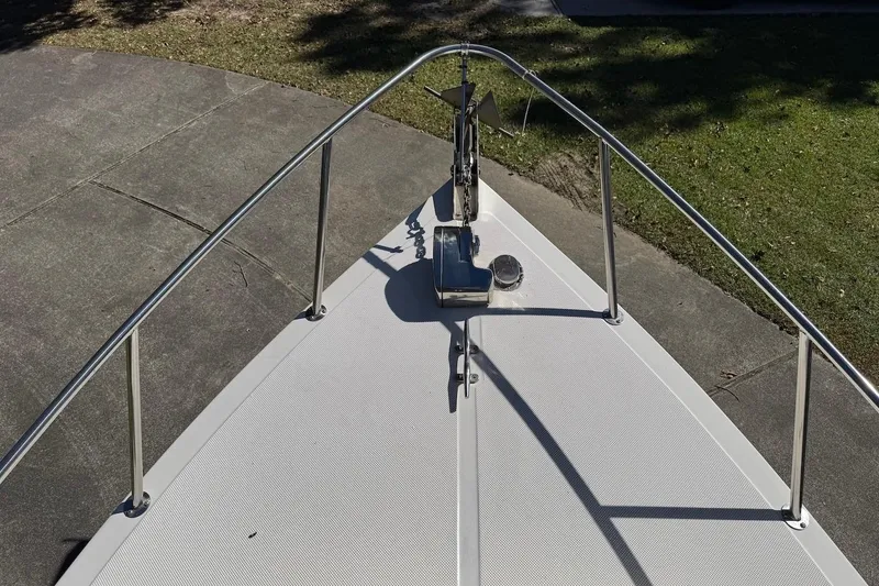 Slide: The Image of Bow view of 2007 C-Dory 25 Pilothouse boat with anchor and railing. - 9