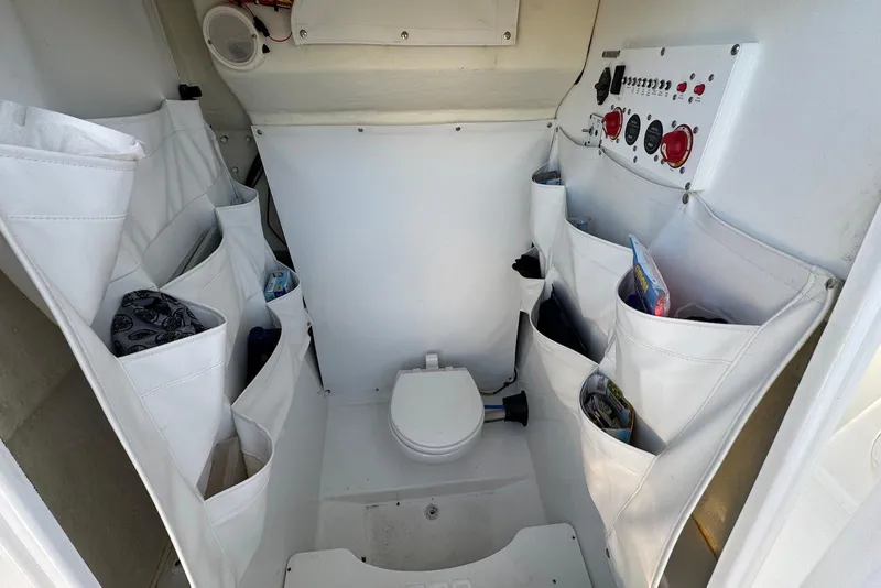 Slide: The Image of 2023 Wellcraft 262 Fisherman boat interior with storage pockets and control panel. - 15