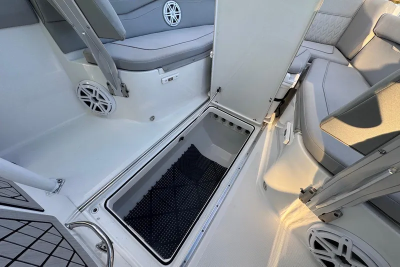 Slide: The Image of 2023 Wellcraft 262 Fisherman boat interior with storage compartment and seating. - 22