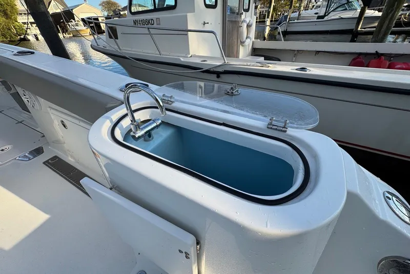 Slide: The Image of 2023 Wellcraft 262 Fisherman boat with onboard sink and storage compartment. - 4