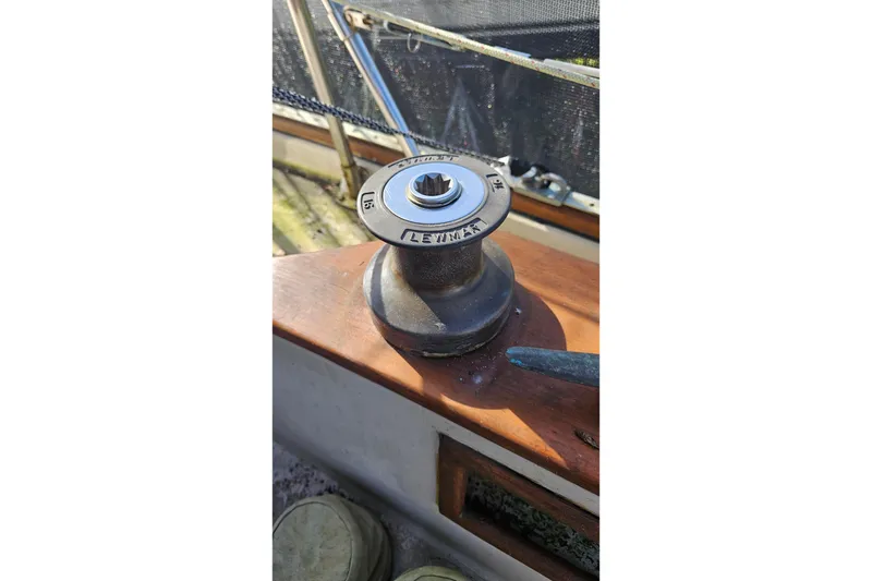 Slide: The Image of Winch on 1988 Bayfield 32C sailboat deck, featuring Lewmar branding. - 11