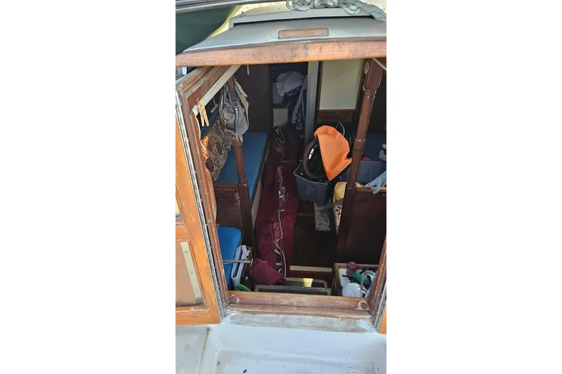 Slide: The Image of Wooden cabin doors on a 1988 Bayfield 32C sailboat. - 14