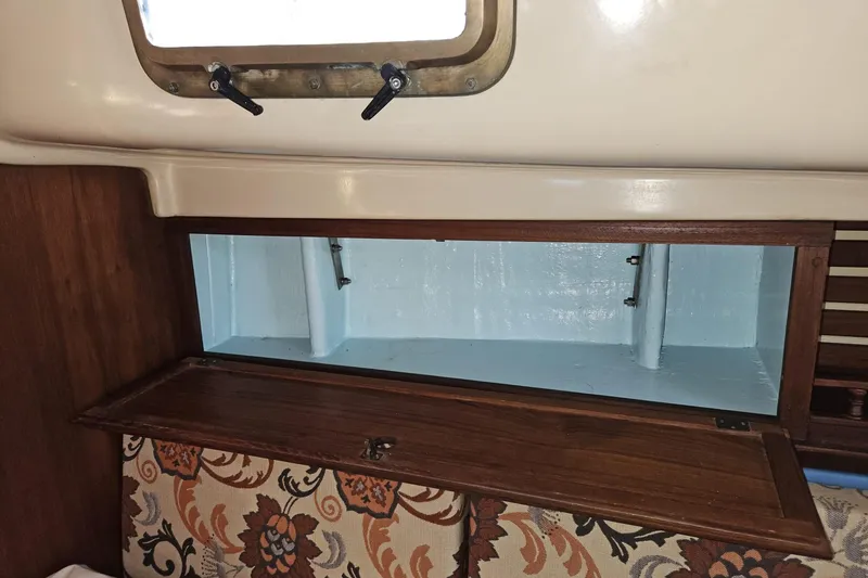 Slide: The Image of Interior storage compartment of a 1988 Bayfield 32C sailboat with floral upholstery. - 33