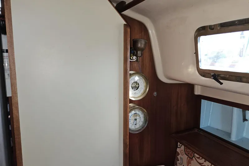 Slide: The Image of Interior of 1988 Bayfield 32C sailboat with nautical instruments and window. - 34