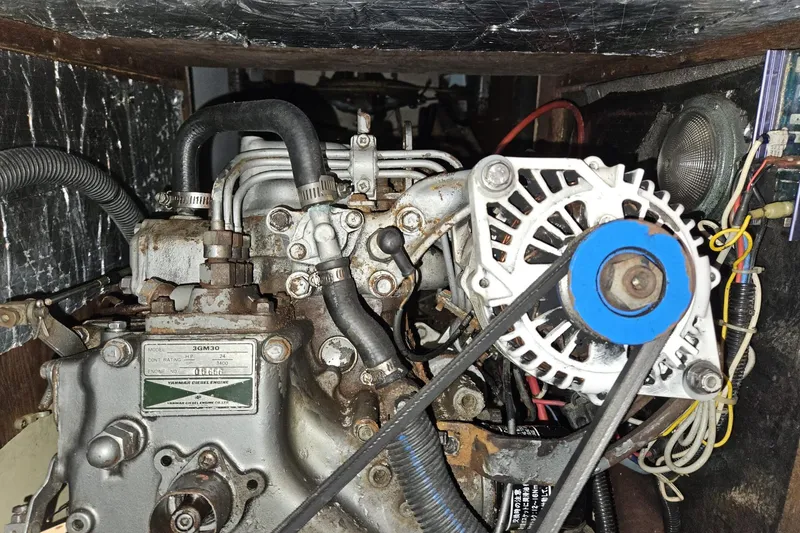 Slide: The Image of Engine compartment of a 1988 Bayfield 32C sailboat, featuring a Yanmar diesel engine. - 46