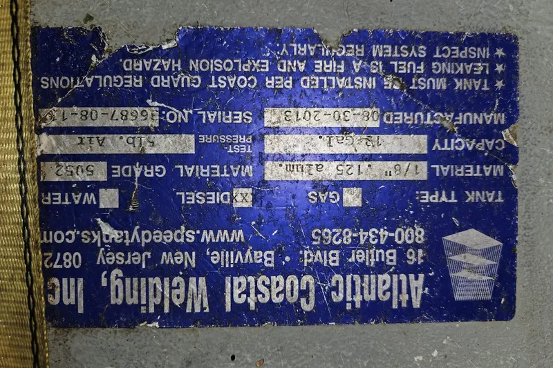 Slide: The Image of Worn label on a Bayfield 32C, 1988, detailing tank specifications and manufacturer information. - 49