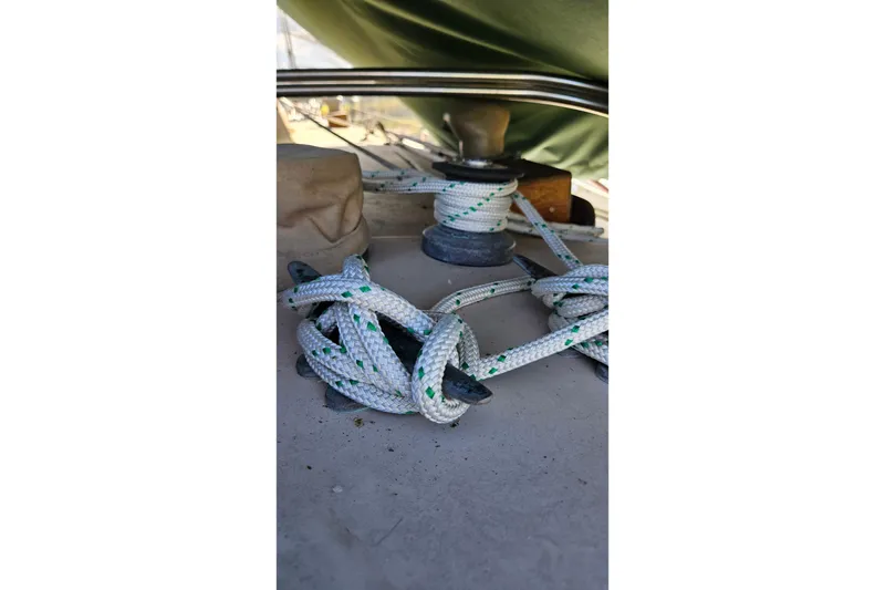 Slide: The Image of Red sail of a 1988 Bayfield 32C sailboat against a clear sky. - 6