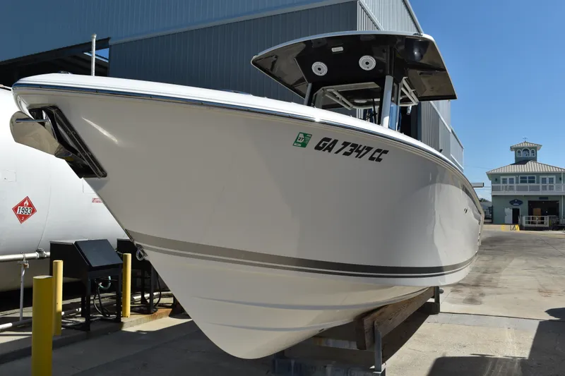 Slide: The Image of 2022 Pursuit S 268 Sport boat logo on white surface. - 1