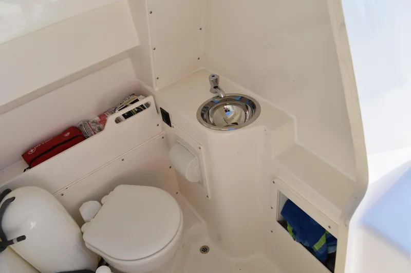 Slide: The Image of Throttle controls of a 2022 Pursuit S 268 Sport boat. - 21