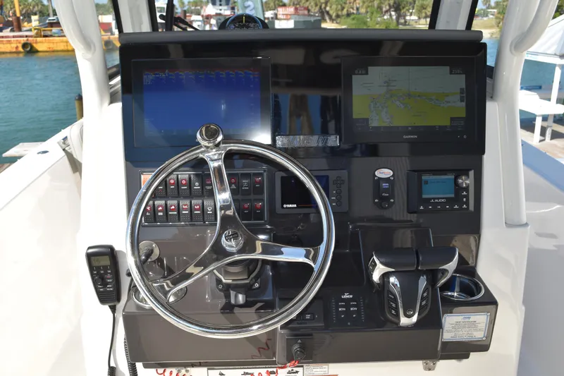 Slide: The Image of 2022 Pursuit S 268 Sport boat interior with cushioned seating and sleek design. - 25