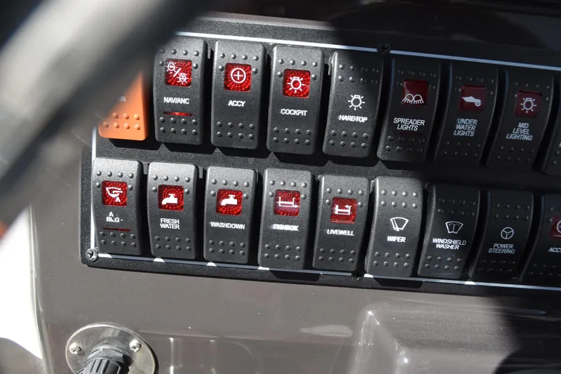 Slide: The Image of 2022 Pursuit S 268 Sport boat with cushioned seating and armrests. - 34