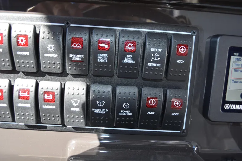 Slide: The Image of 2022 Pursuit S 268 Sport boat interior with cushioned seating and storage. - 35