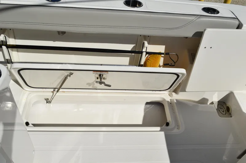 Slide: The Image of 2022 Pursuit S 268 Sport boat console with speakers and windshield wipers. - 40