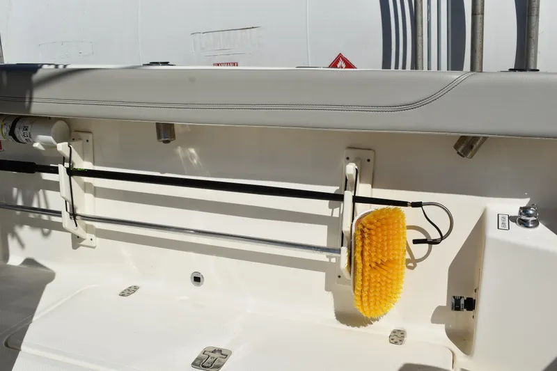 Slide: The Image of 2022 Pursuit S 268 Sport boat side view with logo and window detail. - 42