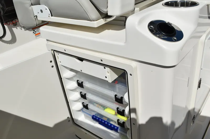 Slide: The Image of 2022 Pursuit S 268 Sport boat at dockside, showcasing spacious deck and seating. - 43