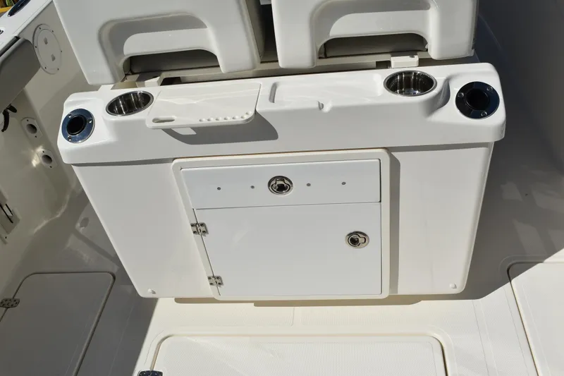 Slide: The Image of 2022 Pursuit S 268 Sport boat storage compartment with open hatch. - 44