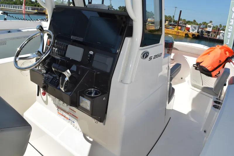 Slide: The Image of 2022 Pursuit S 268 Sport boat with twin Yamaha 200 engines, featuring a sleek deck design. - 46