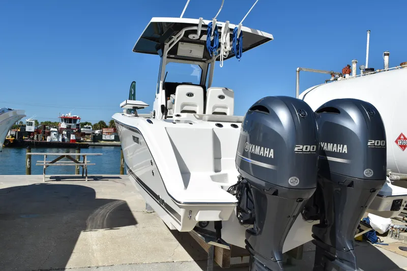 Slide: The Image of Close-up of Yamaha LF200XCA engine part on 2022 Pursuit S 268 Sport boat. - 54