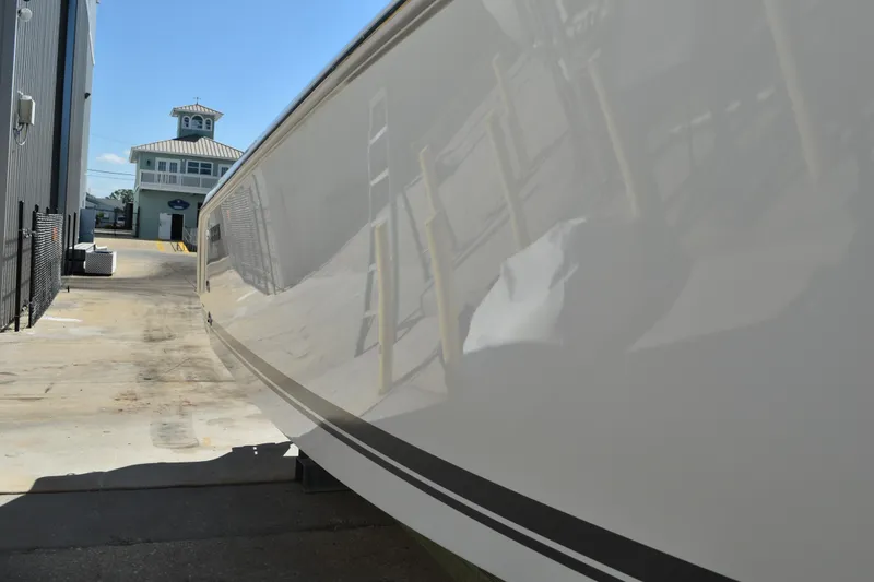 Slide: The Image of Close-up of Yamaha F200XCA engine label on 2022 Pursuit S 268 Sport boat. - 55