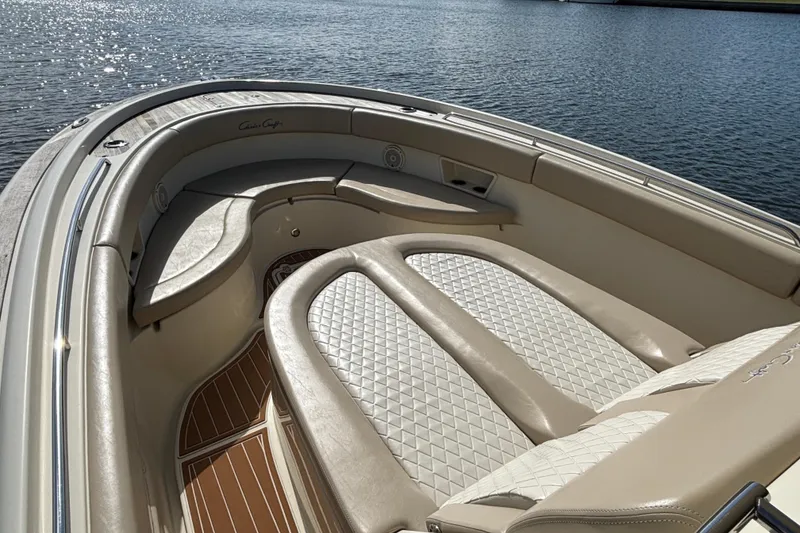Slide: The Image of Luxurious seating on 2018 Chris-Craft Catalina 30 boat, overlooking serene water. - 14