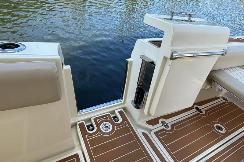 Slide: The Image of 2018 Chris-Craft Catalina 30 boat deck with elegant wood finish and water view. - 16