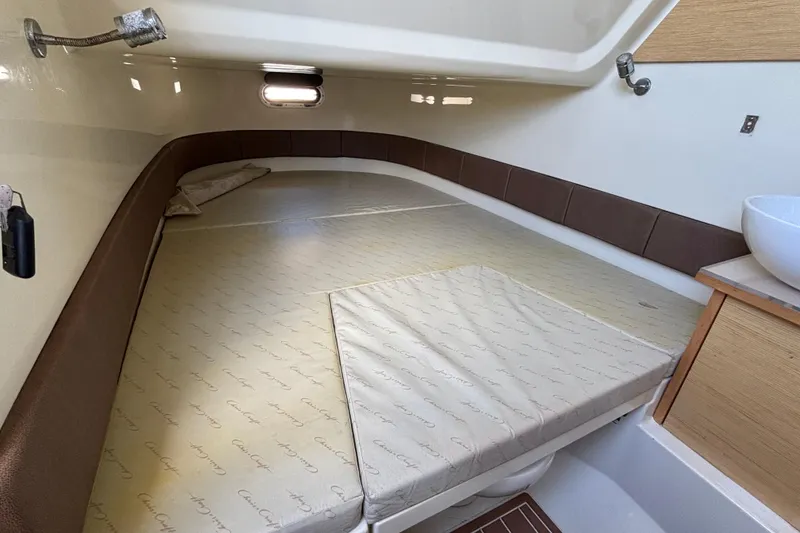 Slide: The Image of 2018 Chris-Craft Catalina 30 cabin interior with bed and sink. - 17
