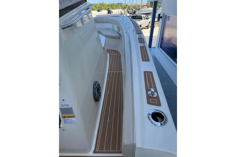 Slide: The Image of 2018 Chris-Craft Catalina 30 boat with twin engines on water. - 7