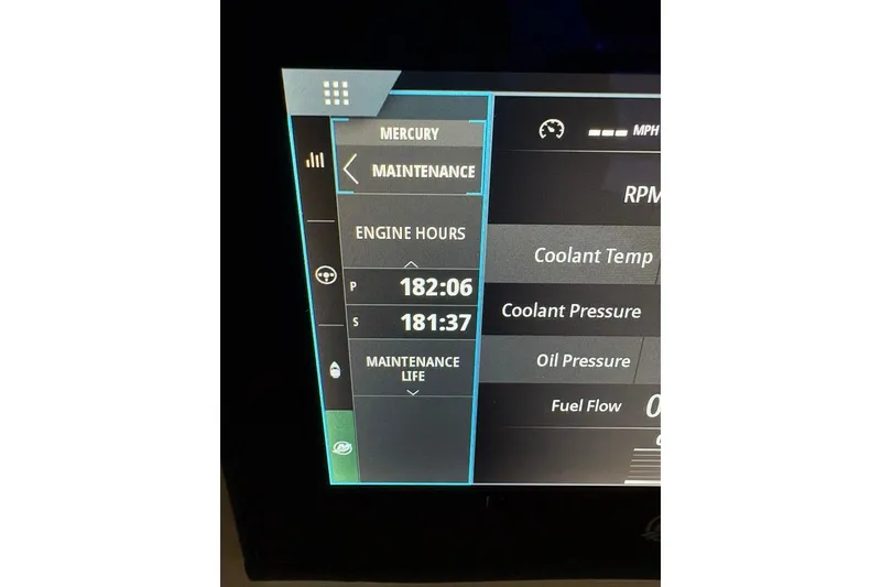 Slide: The Image of Display screen showing engine hours and maintenance data for 2022 Boston Whaler 325 Conquest. - 11