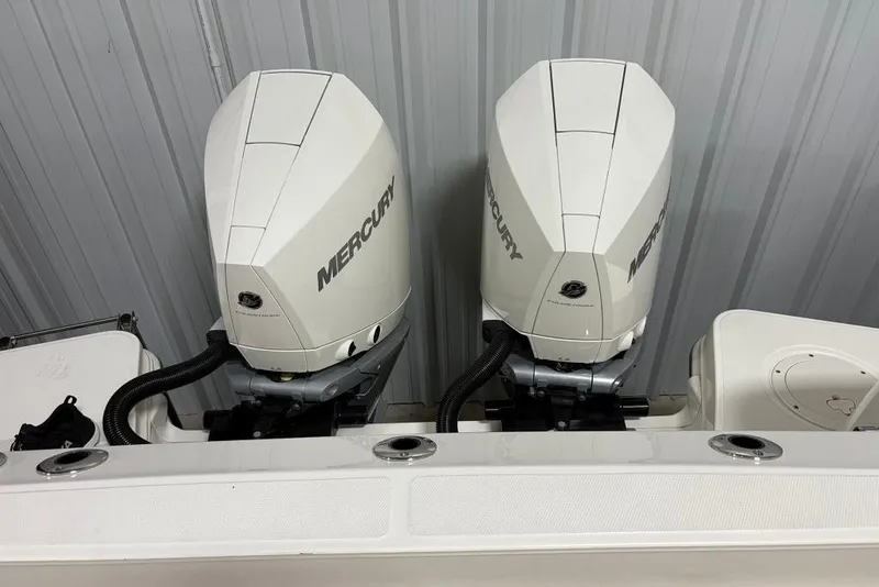 Slide: The Image of Twin Mercury outboard engines on a 2022 Boston Whaler 325 Conquest boat. - 7