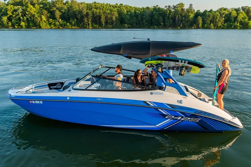 Slide: The Image of 2019 Yamaha Boats 242X E-Series interior seating with blue and gray accents. - 2