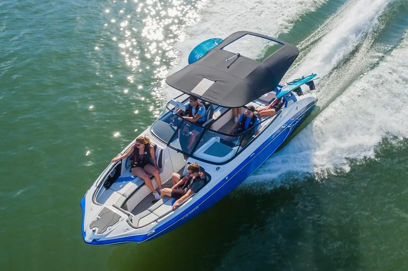 Slide: The Image of 2019 Yamaha Boats 242X E-Series interior with blue and gray seating, showcasing modern design. - 3