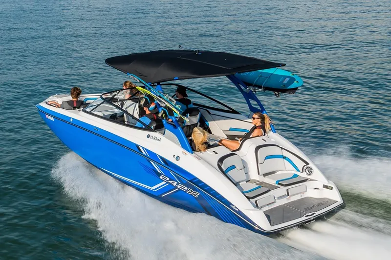 Slide: The Image of 2019 Yamaha Boats 242X E-Series interior with blue and gray seating, modern design. - 5