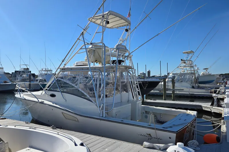 The Image of 2003 Albemarle 320 Express Fisherman boat docked at marina under clear blue sky. - 0