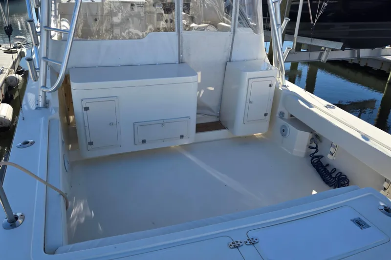 Slide: The Image of 2003 Albemarle 320 Express Fisherman boat deck with storage compartments and clean layout. - 11