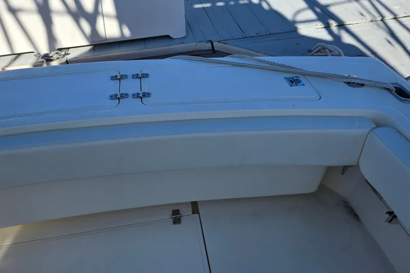 Slide: The Image of 2003 Albemarle 320 Express Fisherman boat deck with storage compartments and seating. - 13