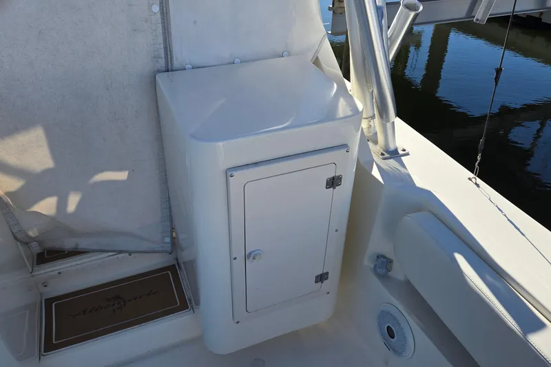 Slide: The Image of 2003 Albemarle 320 Express Fisherman boat interior with storage compartment and seating. - 15