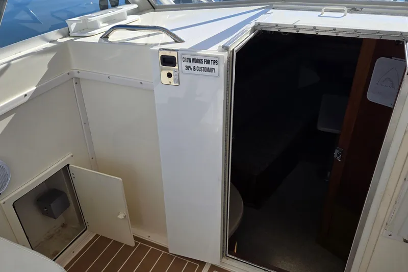 Slide: The Image of 2003 Albemarle 320 Express Fisherman cabin entrance with tip sign on door. - 18