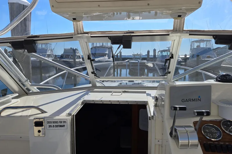 Slide: The Image of 2003 Albemarle 320 Express Fisherman boat interior with Garmin equipment at marina. - 19