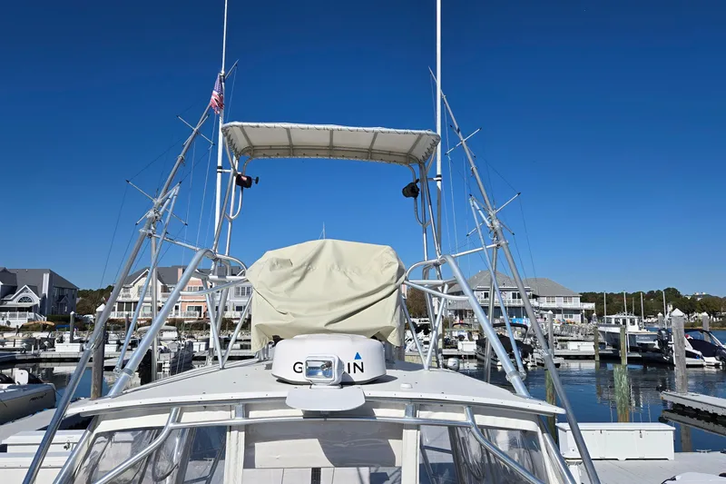 Slide: The Image of 2003 Albemarle 320 Express Fisherman boat docked at marina under clear blue sky. - 28