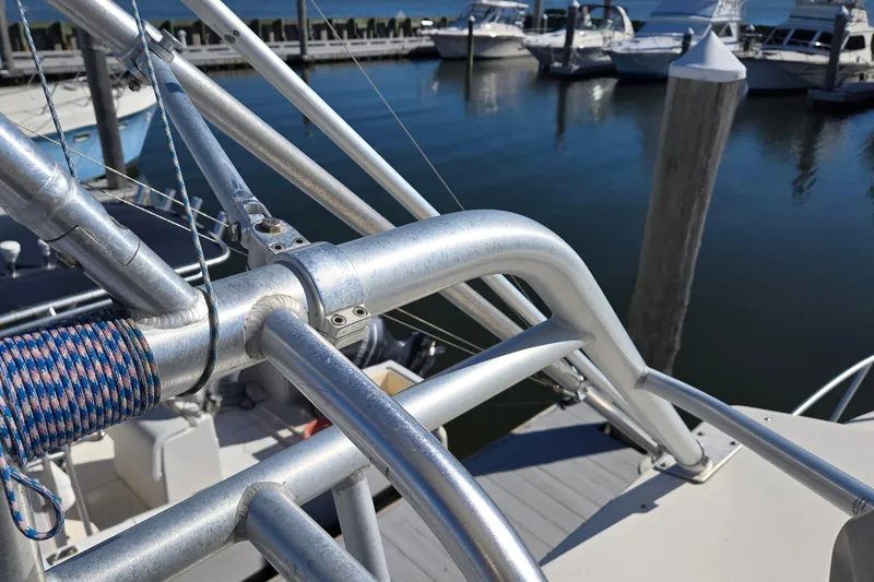 Slide: The Image of Albemarle 320 Express Fisherman 2003 boat railing and rigging at marina. - 30