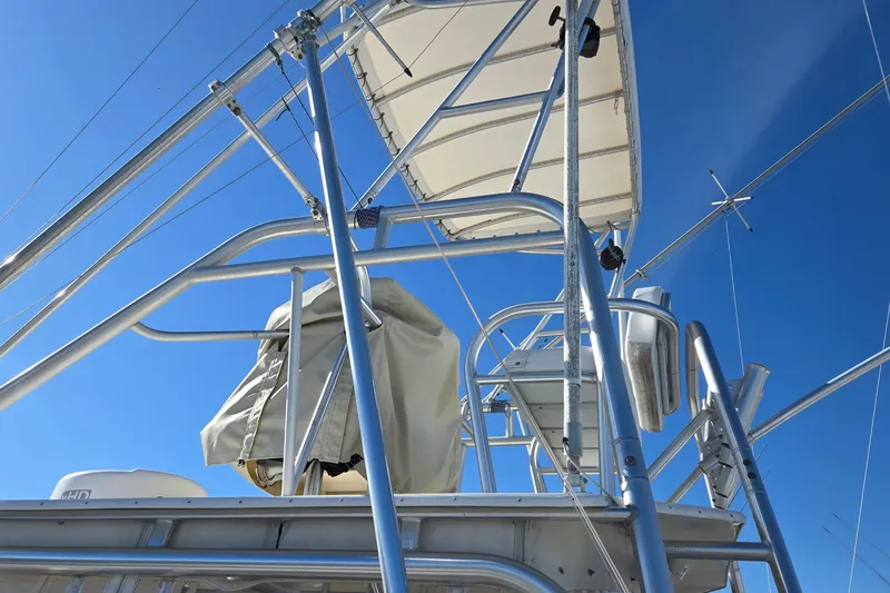Slide: The Image of White cushioned seat on 2003 Albemarle 320 Express Fisherman boat, dockside view. - 32