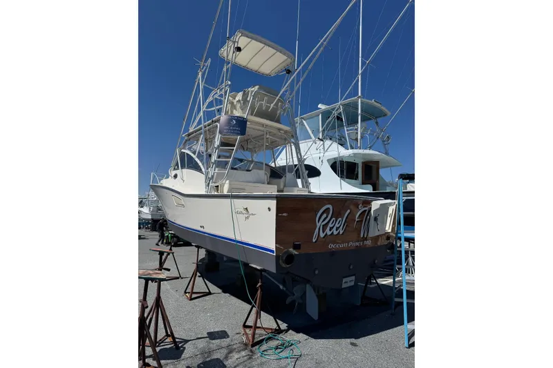 Slide: The Image of 2003 Albemarle 320 Express Fisherman boat on stands, ready for maintenance. - 34