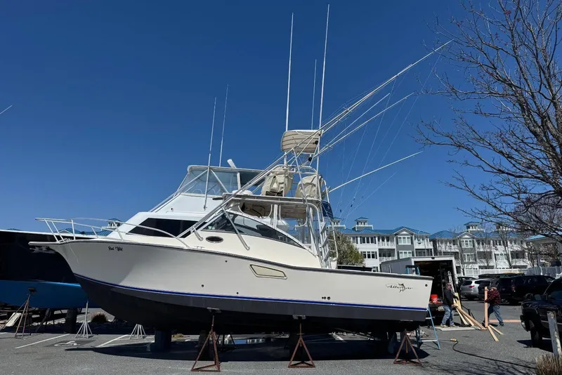 Slide: The Image of 2003 Albemarle 320 Express Fisherman boat on stands, clear sky background. - 36