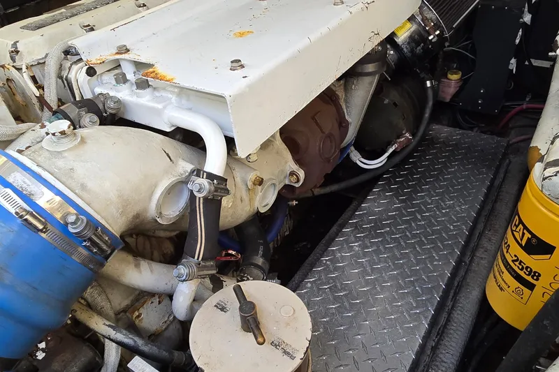 Slide: The Image of Engine compartment of a 2003 Albemarle 320 Express Fisherman boat, showing mechanical components. - 39