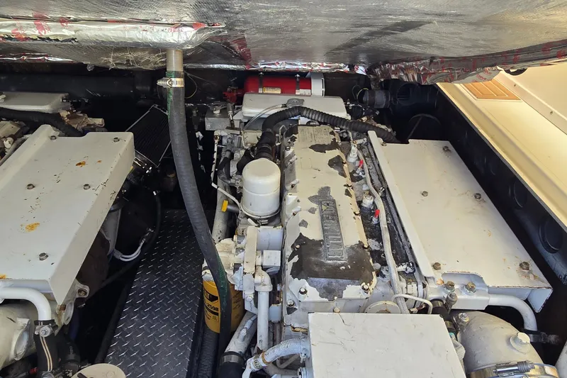 Slide: The Image of Engine compartment of a 2003 Albemarle 320 Express Fisherman boat, showcasing machinery and components. - 38