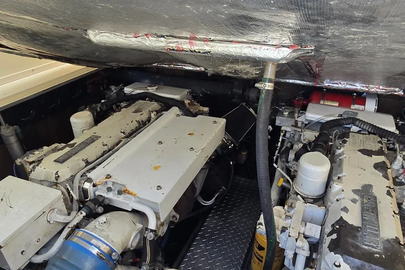 Slide: The Image of Engine compartment of a 2003 Albemarle 320 Express Fisherman boat, showing dual engines. - 37